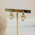 Arete argolla lazo con perla blanca