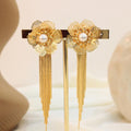 Arete flor largo con perla blanca
