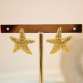 Arete estrella con zirconia