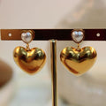 Arete acero corazon doble con perla