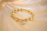 Pulsera de perlas doradas